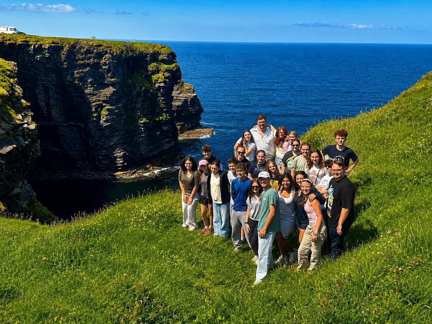 Irish Way students gathered on a clifftop above the Atlantic