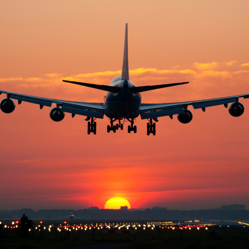 Airplane Taking Off at Sunset